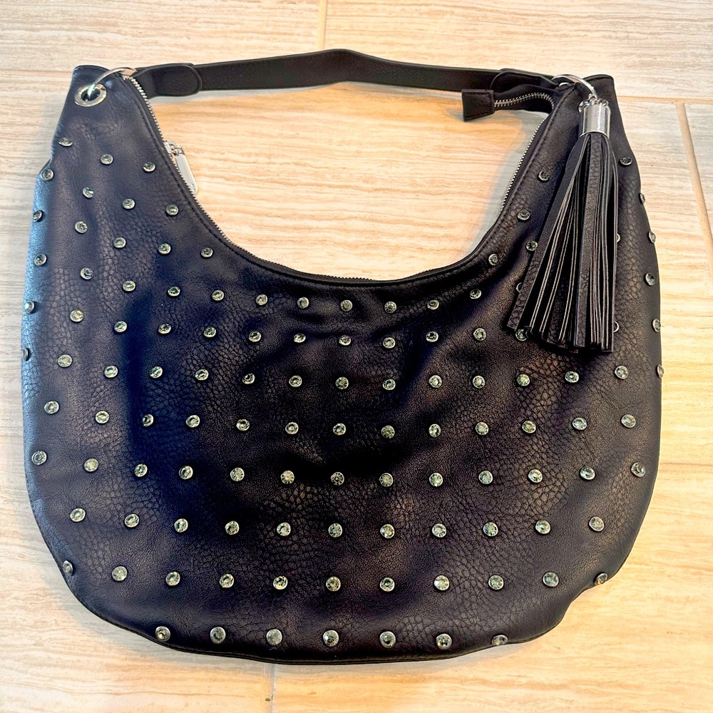 Black purse with green, studs and fringe